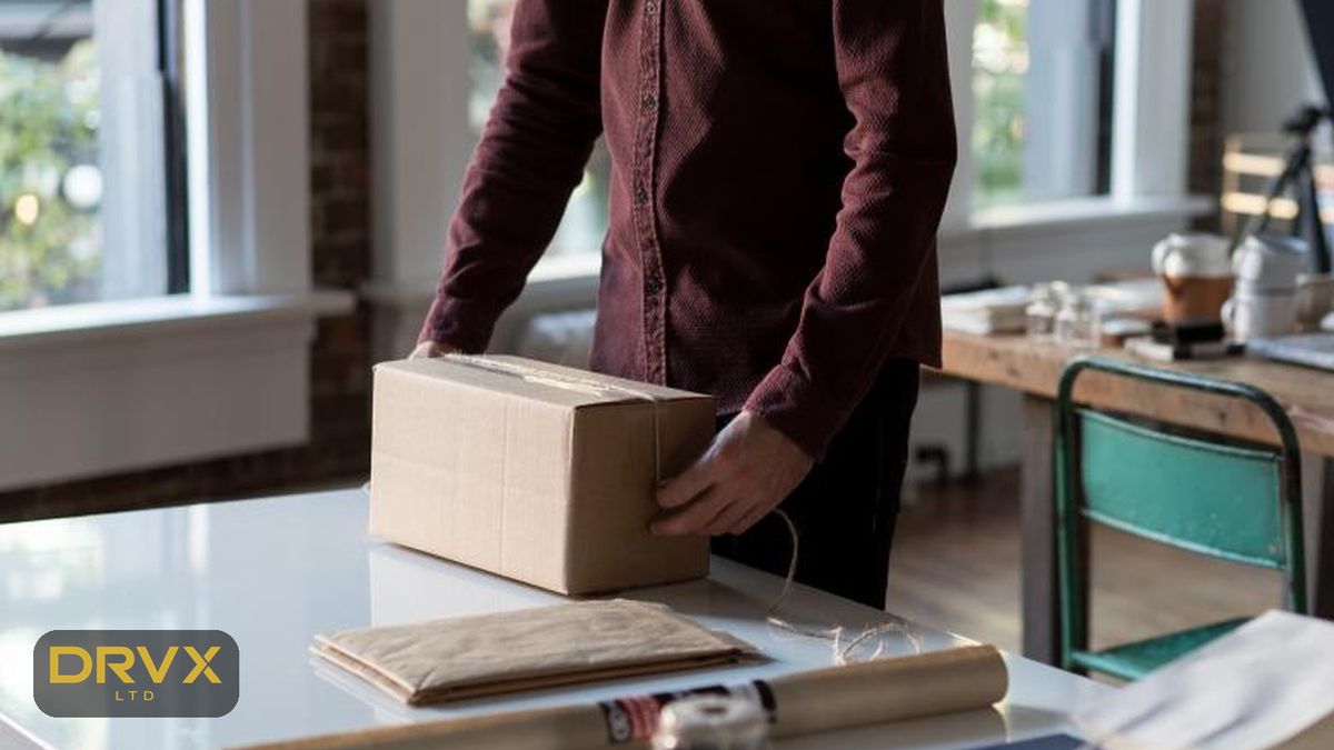 Illustrative image: an order being packed into a cardboard box at a packing table, with a gold DRVX mark