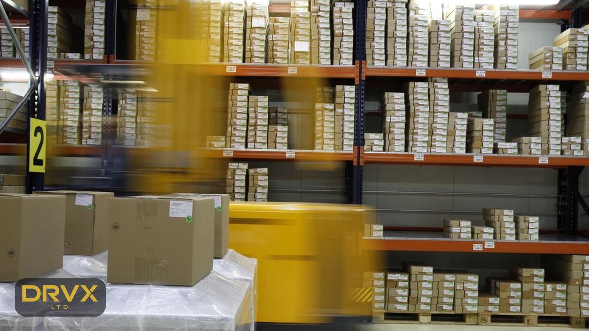 Illustrative image: warehouse racking stocked with boxed goods, with a gold DRVX mark
